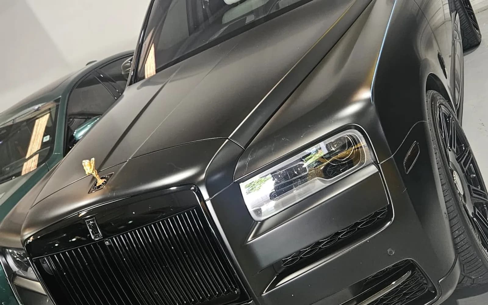 Rolls-Royce Cullinan Black Badge matte black with white interior